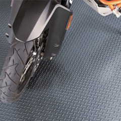 G-Floor Diamond Tread Vinyl Multipurpose Roll 75 Mil x 5x10 Ft. parked on motorcycle in slate gray
