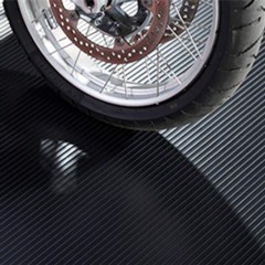 Motorcycle park on G-Floor Ribbed Tread Vinyl Multipurpose Roll 55 mil x 5x10 Ft. in midnight black