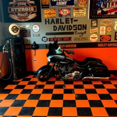 RaceDeck Diamond Garage Floor Tile 1/2 Inch x 1x1 Ft. black and orange tile with motorcycle