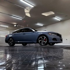 Car parked on RaceDeck Diamond TuffShield Garage Floor Tile 1/2 Inch x 1x1 Ft. in black and graphite