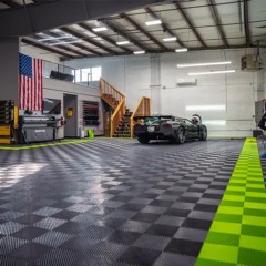 Detailing shopt with RaceDeck Free-Flow Garage Floor Tile 1/2 Inch x 1x1 Ft. in black and sublime