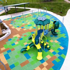 colorful rubber playground tiles in an outdoor playground thumbnail