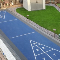 outdoor court foundation panel installed for shuffleboard court with court tiles over the top