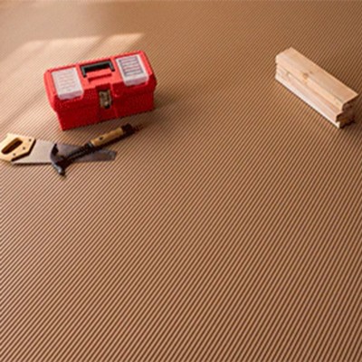 Sandstone G-Floor Ribbed Tread Vinyl Multipurpose Roll 55 mil x 5x10 Ft. with carpenter tools