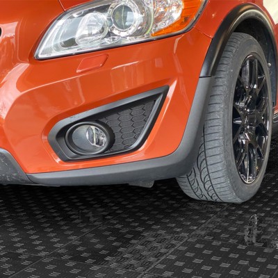 black and gray garage floor tiles diamond pattern with orange car