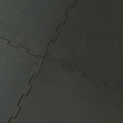four interlocking rubber horse stall mats connected together