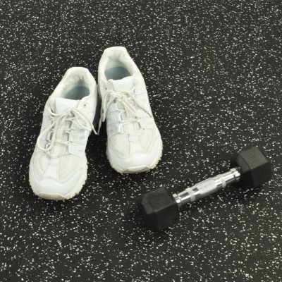 Rolled Rubber Sport West 10% Color 3/8 Inch Per SF in with dumbbell and shoes