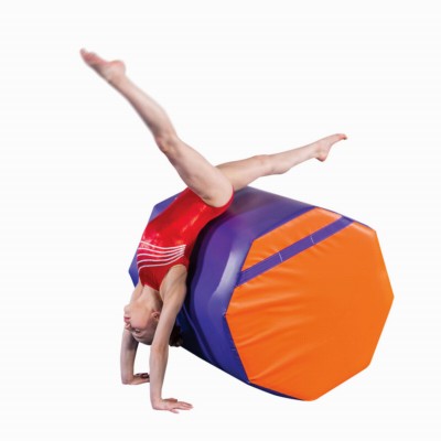 gymnast practicing on purple and orange octagon mat