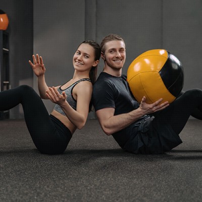 Rolled Rubber three eighths 20 percent color with man and woman using medicine ball