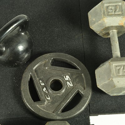 Weights on Sterling rubber gym tiles 1.25 Inch Black