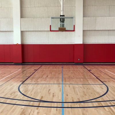 red safety wall pads installed wall to wall in gymnasium