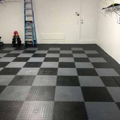 black and gray interlocking tiles installed in garage