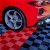 perforated garage floor tiles with corvette in garage