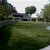 endless summer landscaping turf on backyard with rock wall