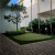 Money Putt Artificial Grass Turf Roll 15 Ft in small putting green surrounded by brick pavers