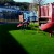 Play Time Playground artificial turf in park with jungle gym and Red Slide