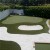 Troon Artificial Turf in backyard mini golf course featuring a putting and chipping area with sand trap