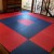 interlocking red and blue installation of bjj grappling puzzle mats