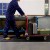 person with cart walking on Firmagrip Industrial Matting in industrial facility