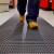 close up of person walking on heronair matting in manufacturing facilitiy