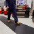 person walking on heronair matting in manufacturing facilitiy