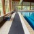 Heronrib Wet Area Safety Matting Roll next to indoor pool