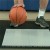 plastic basketball court tiles over top of plyometric rubber underlayment