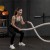 Rolled Rubber 20 percent color with woman using battle ropes