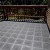 StayLock Perforated Black outdoor tiles installed over existing wood deck