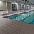 light gray staylock waterproof deck tiles used as indoor pool flooring