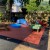 Staylock Perforated Outdoor Floor Tile play area terra cotta color.