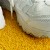 Greatmats Gym Turf Value 3/4 Inch x 15 Ft. Wide 5 mm Foam - Yellow turf White shoes