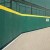 Outdoor Field Wall Padding with Grommets 7 ft x 4 ft green pad.
